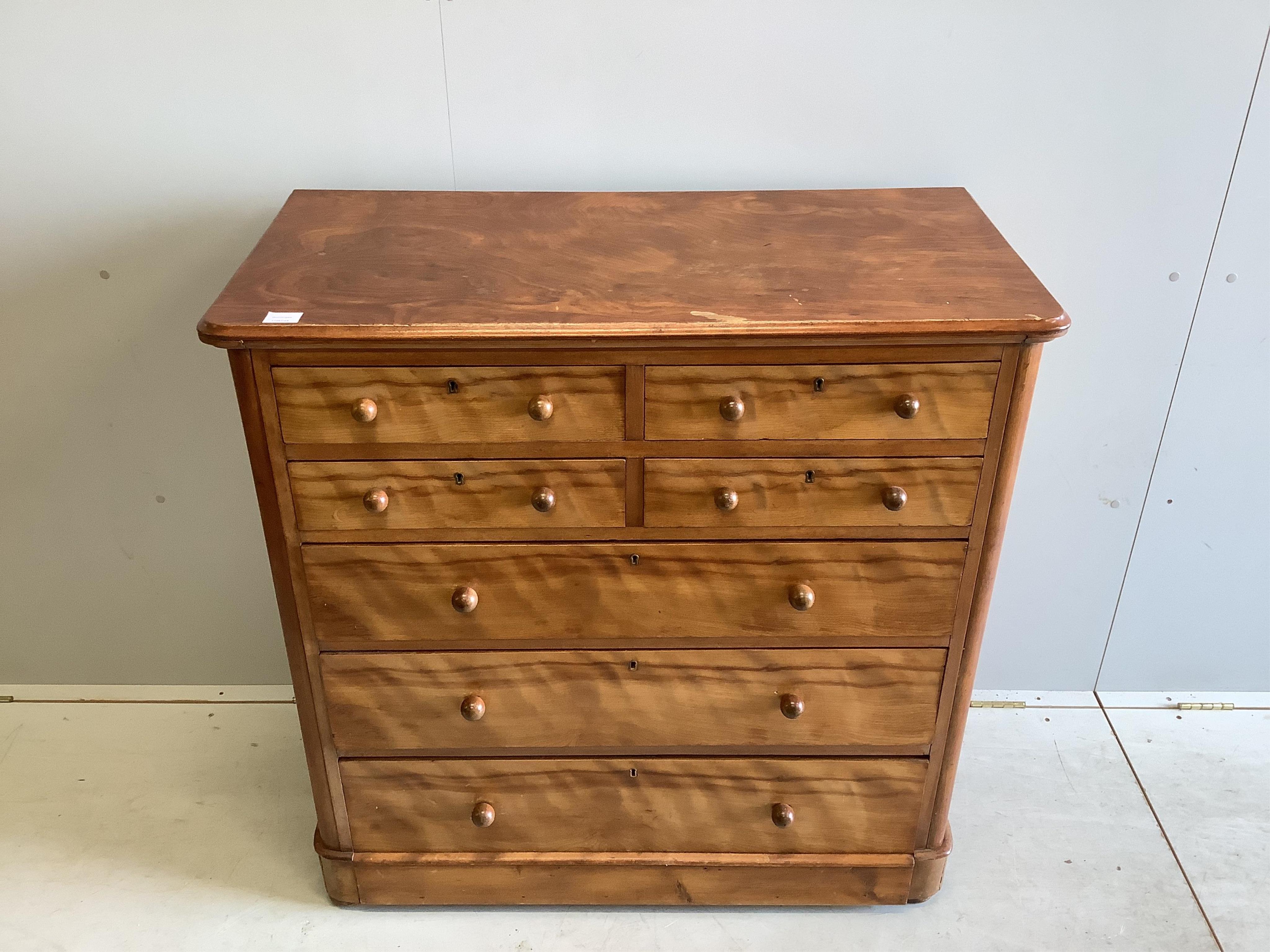 A Victorian satin birch chest of drawers, stamped Moore and Hunton, London, width 104cm, depth 51cm, height 105cm. Condition - poor to fair